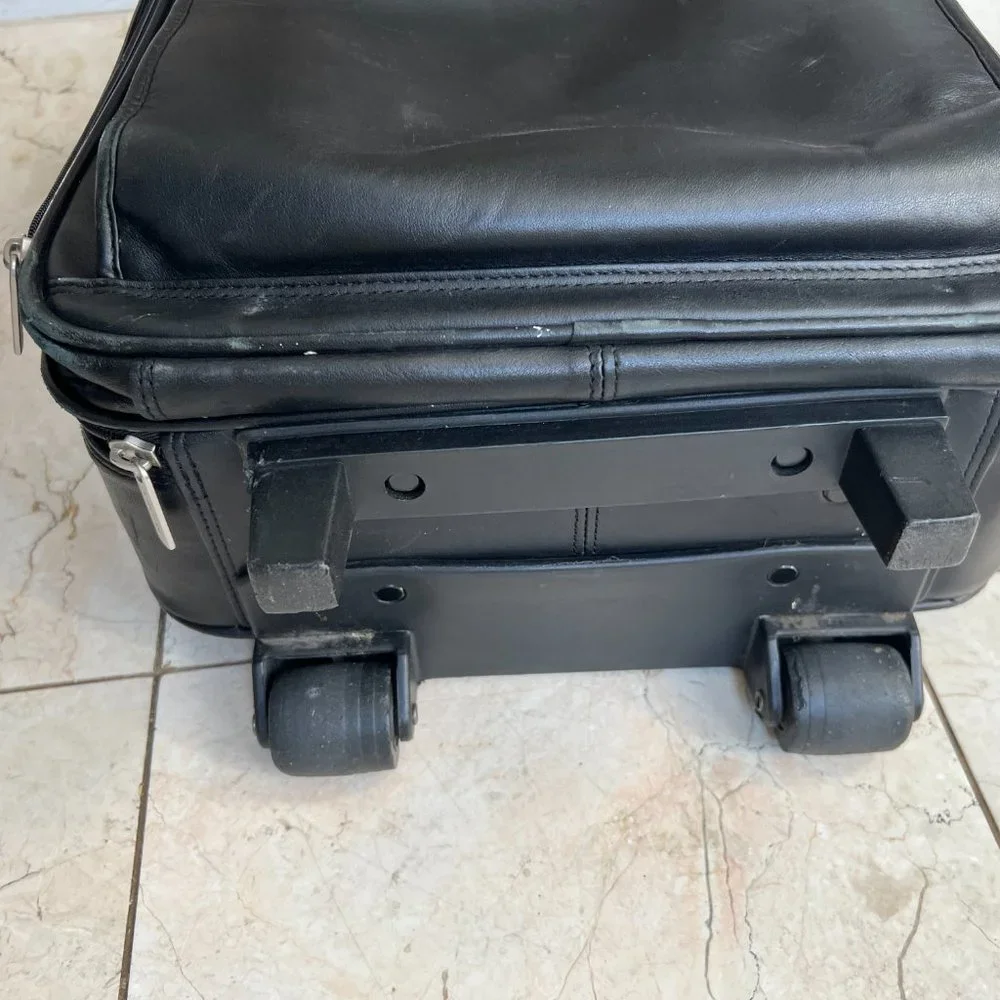 Wilson’s Black Leather Carry on Luggage.